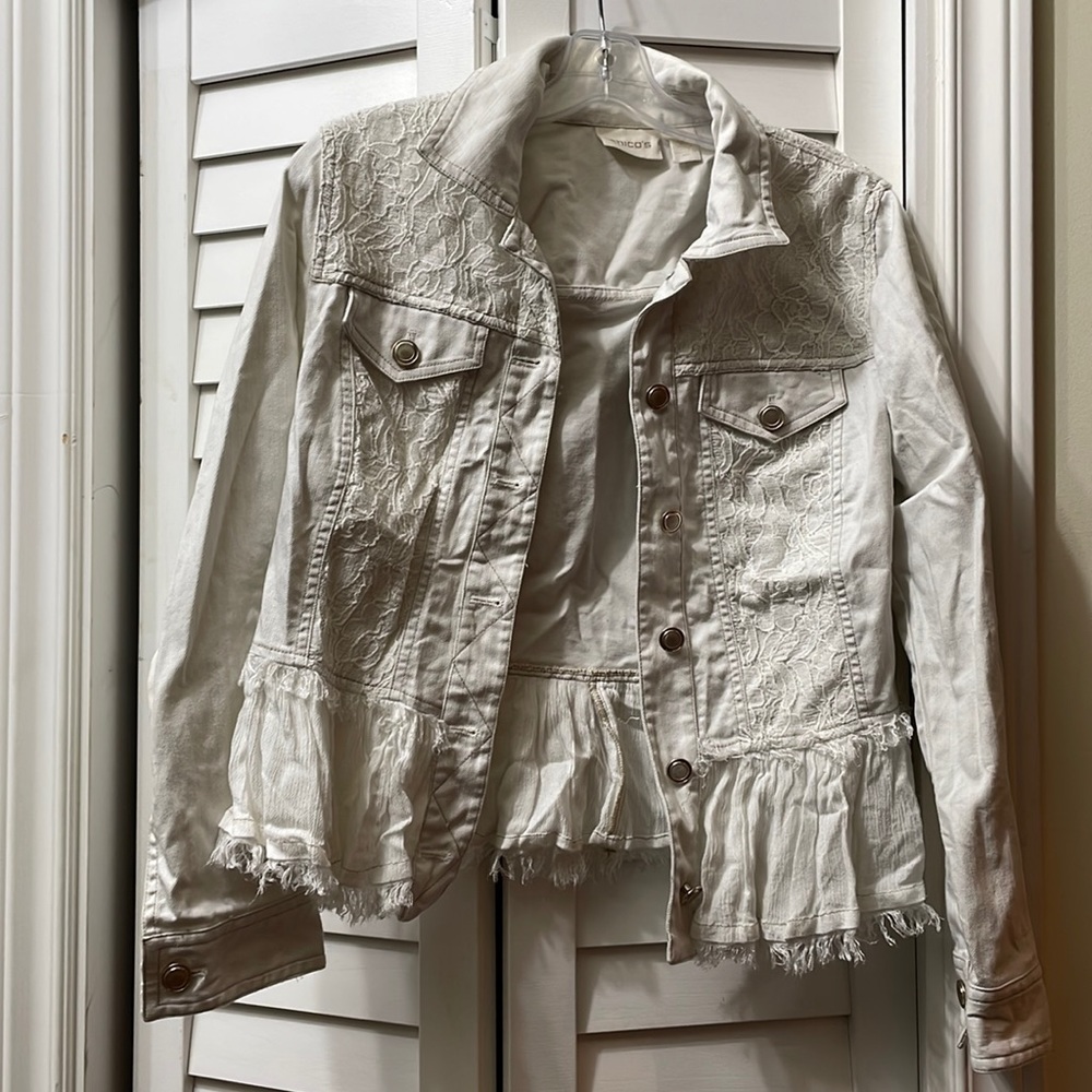 Cute Chico white denim jacket. Lace and ruffle trim. Chico size 0.